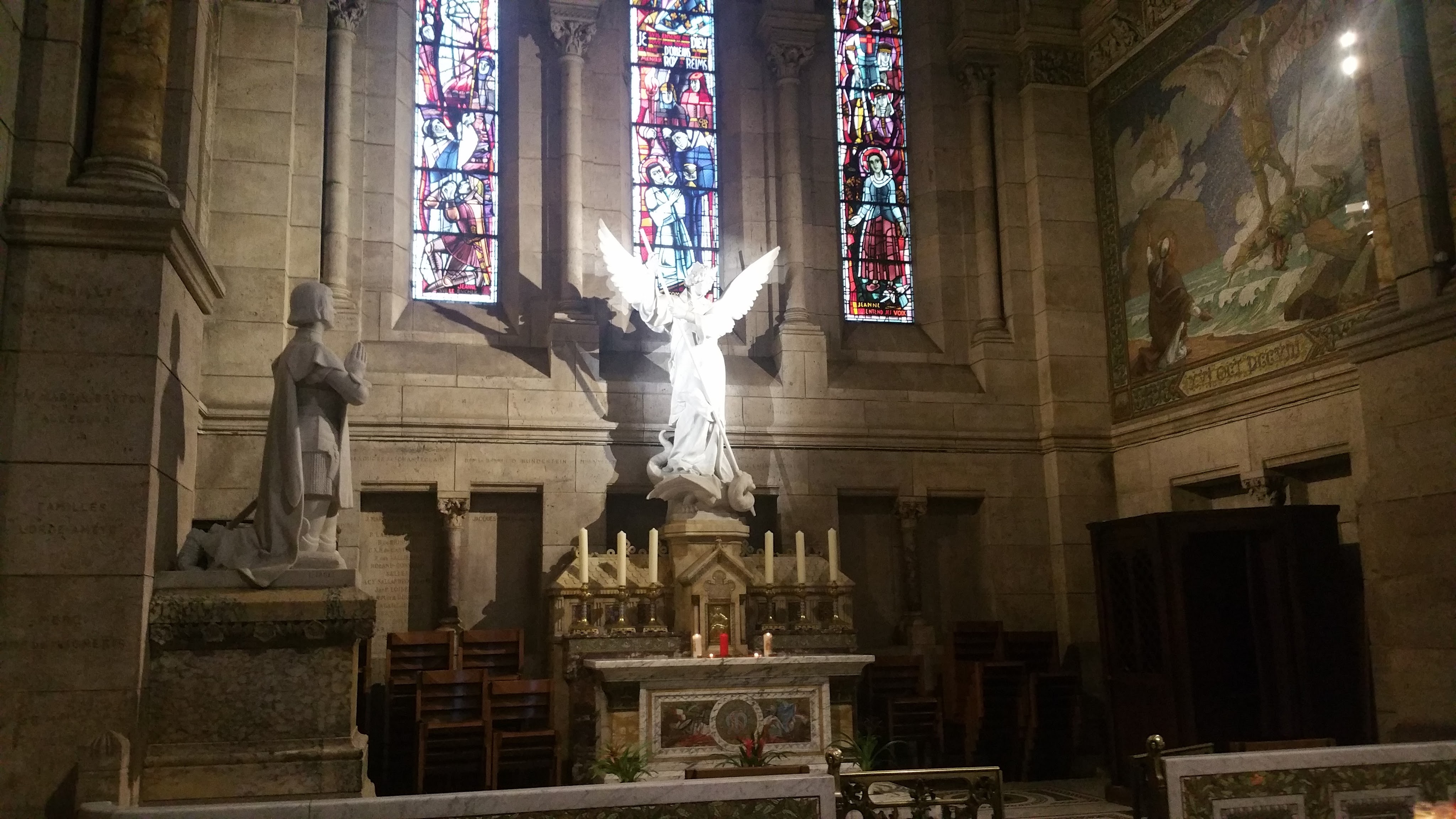 Angel illuminated by the sun inside the Sacre-Coeur