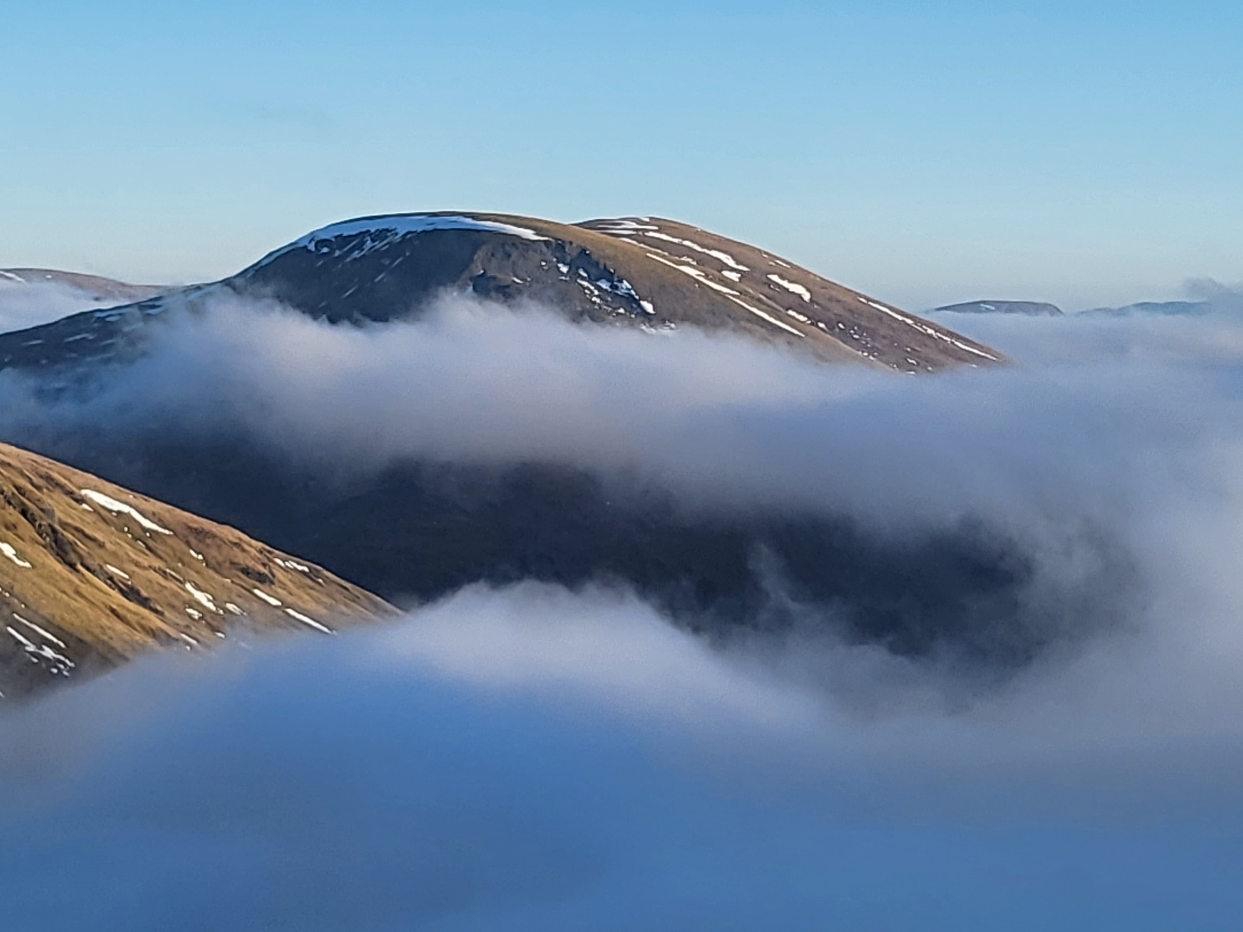 Mountains rising above the clouds
