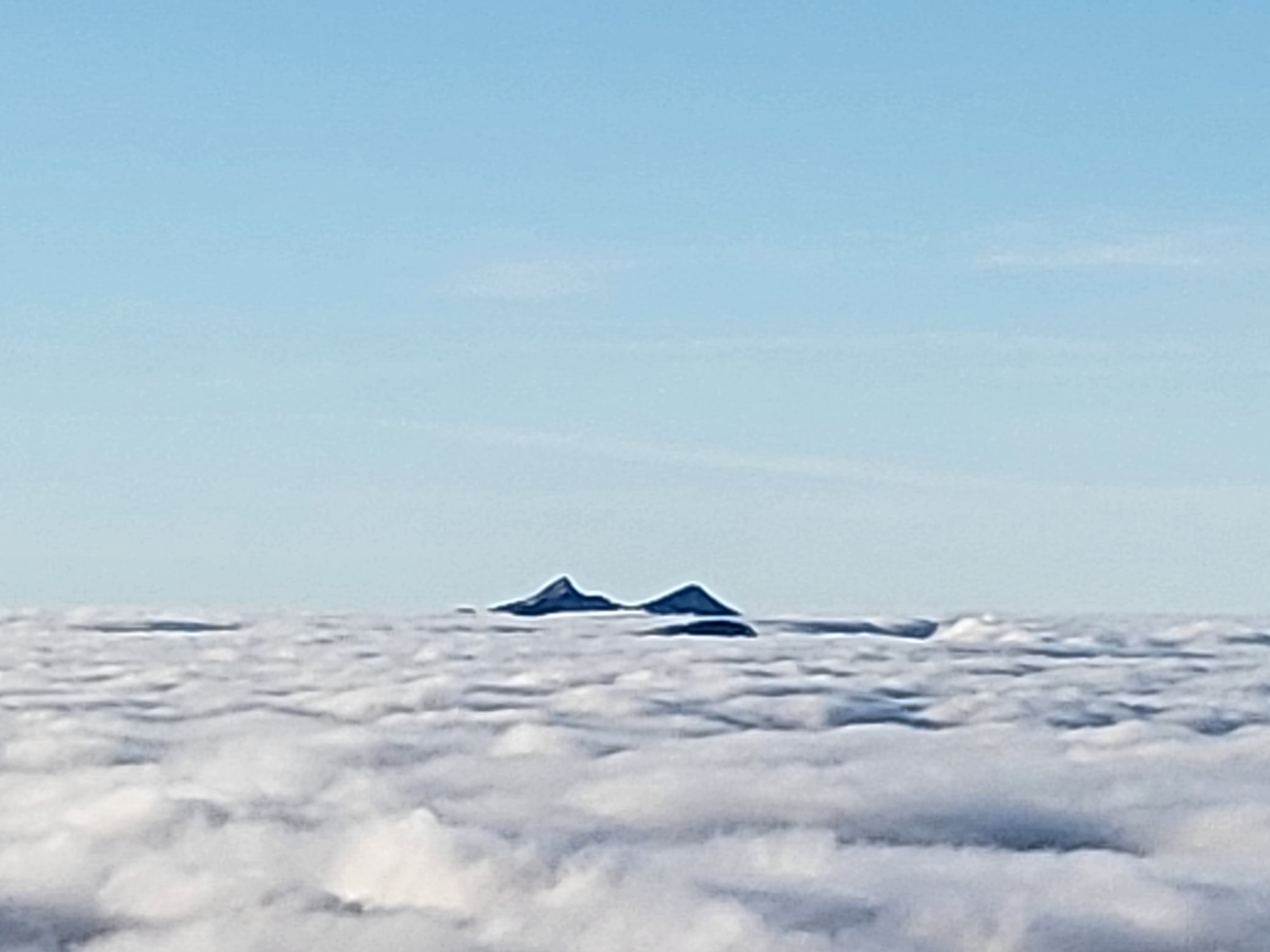 Mountain tops poking through a cloud Inversion