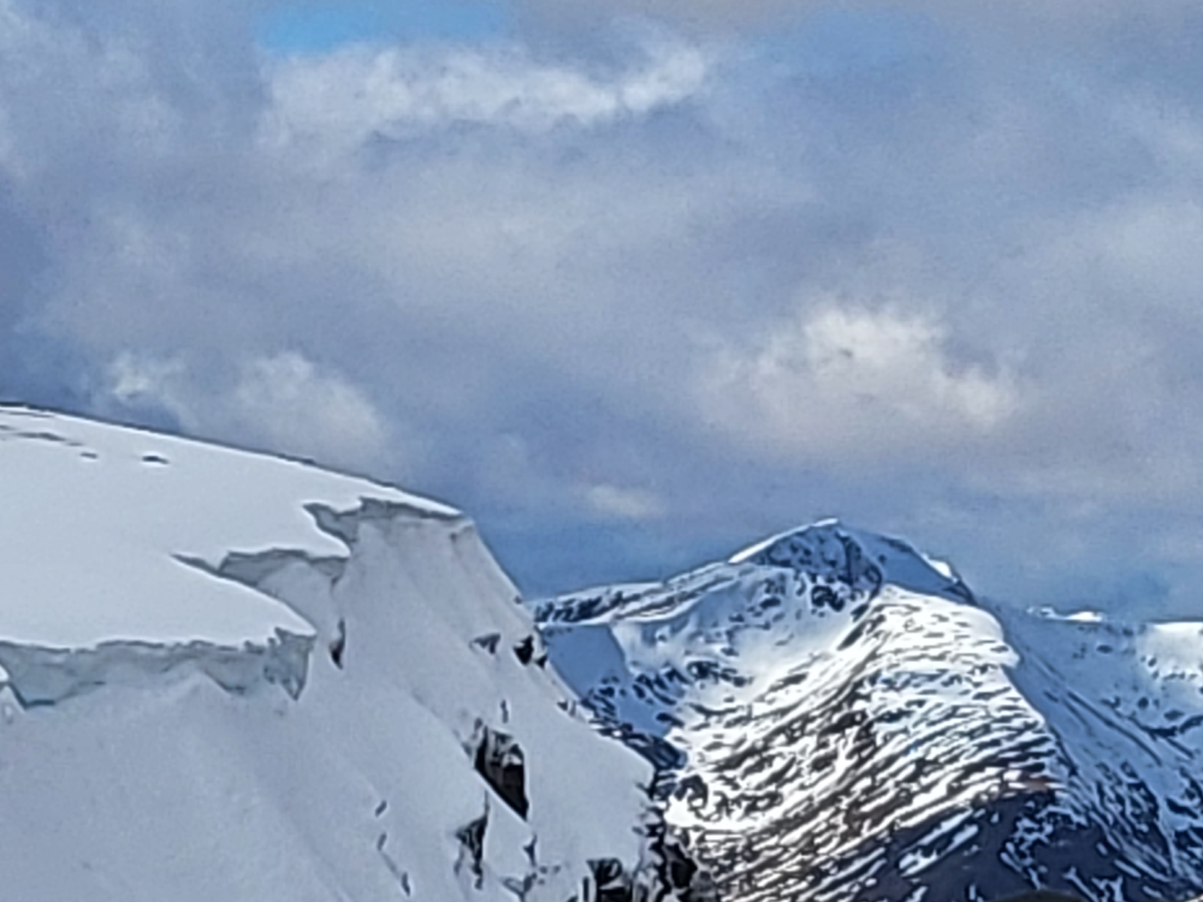 Cornice with snow capped mountains in the distance
