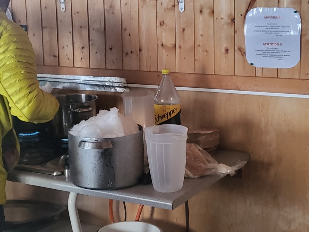 Melting snow for water.