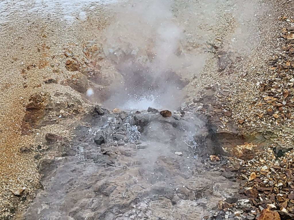 Boiling water from a volcanic hot spring.