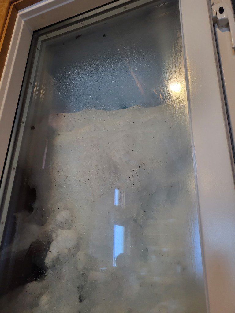 Deep snow outside the windows.